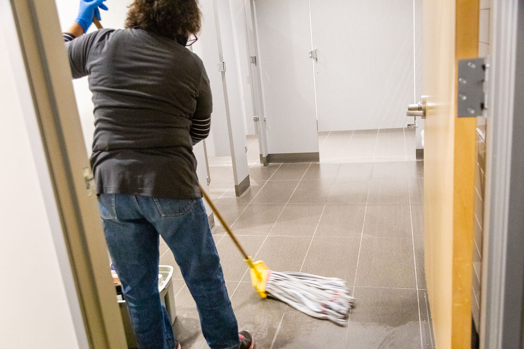 Woman mopping the floor